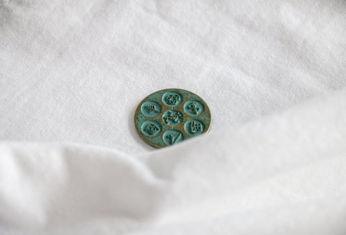 Weavabel green oxidised steel green enamel branded button